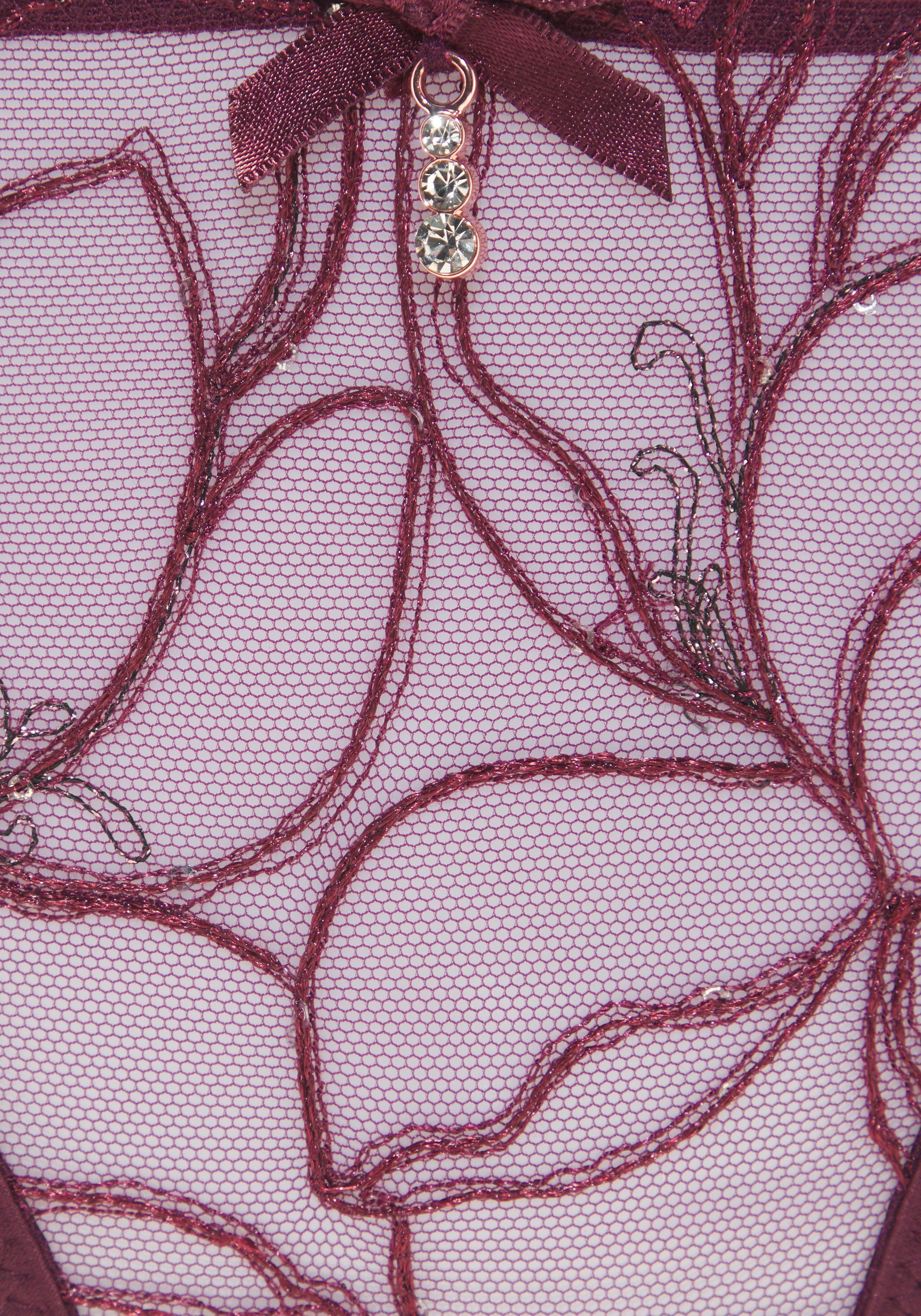 Lascana String met glanzende kant en spannende bandlook